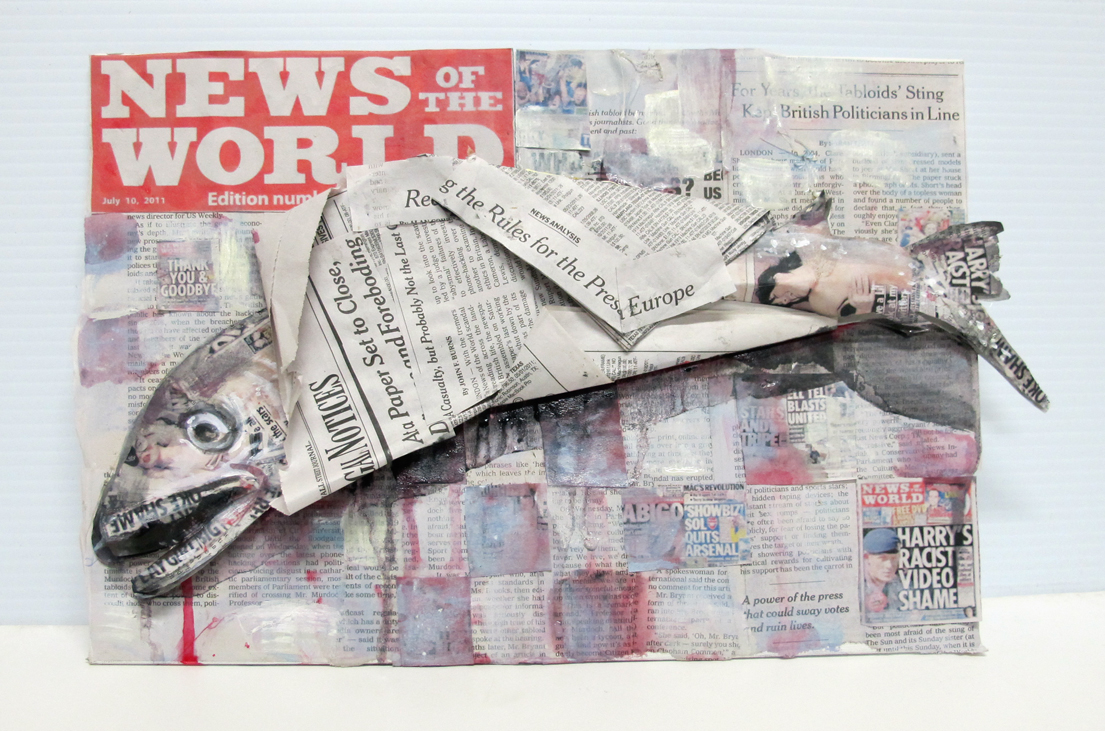 A painted fish made of paper wrapped in the Daily News